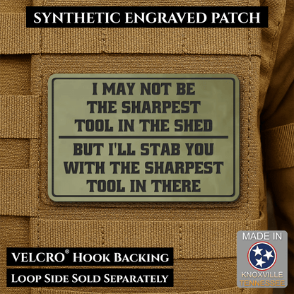 Front design and hook backing of Not The Sharpest Tool In The Shed patch in olive green