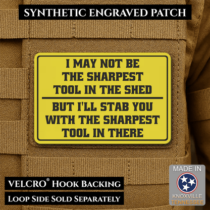 Front design and hook backing of Not The Sharpest Tool In The Shed patch in yellow