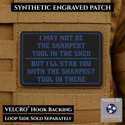 Front design and hook backing of Not The Sharpest Tool In The Shed patch in black / blue