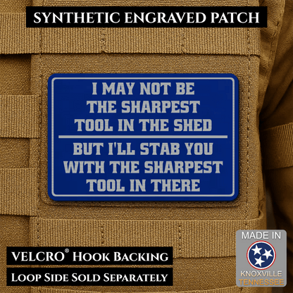 Front design and hook backing of Not The Sharpest Tool In The Shed patch in blue / silver