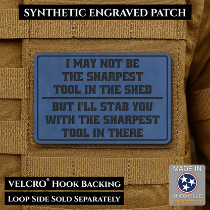 Front design and hook backing of Not The Sharpest Tool In The Shed patch in indigo blue