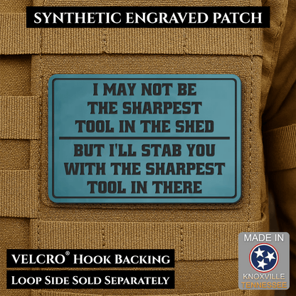 Front design and hook backing of Not The Sharpest Tool In The Shed patch in topaz blue