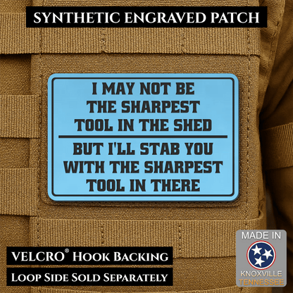 Front design and hook backing of Not The Sharpest Tool In The Shed patch in sky blue