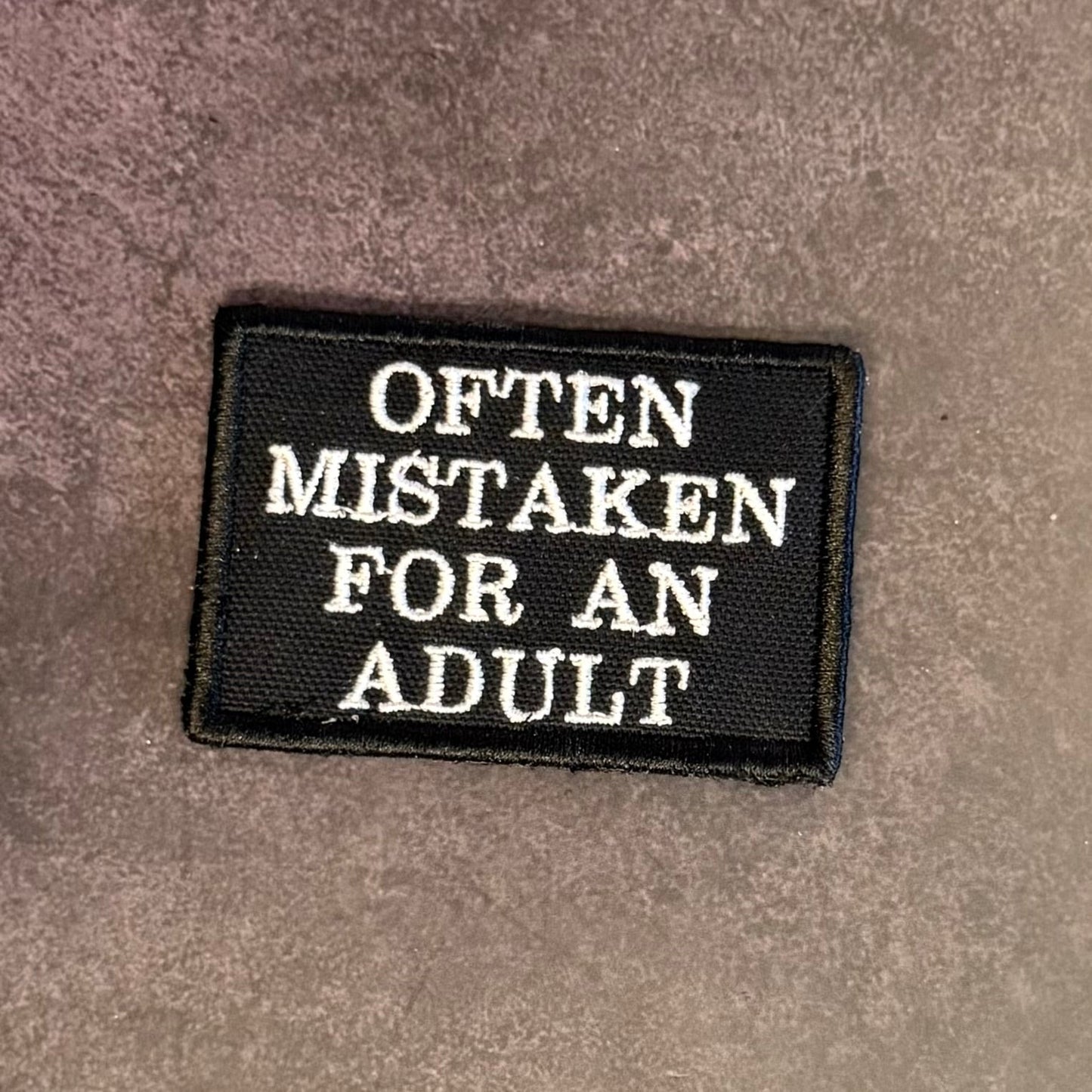 Often Mistaken For An Adult Funny Morale Patch, 2x3" | Made in USA | VELCRO® Brand Hook Backing - LoneStar Adhesive