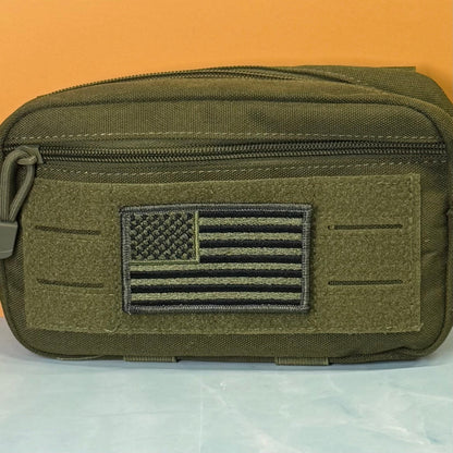 Olive OD Green Tactical American Flag patch in olive green and black stars and stripes, mounted on an olive utility pouch