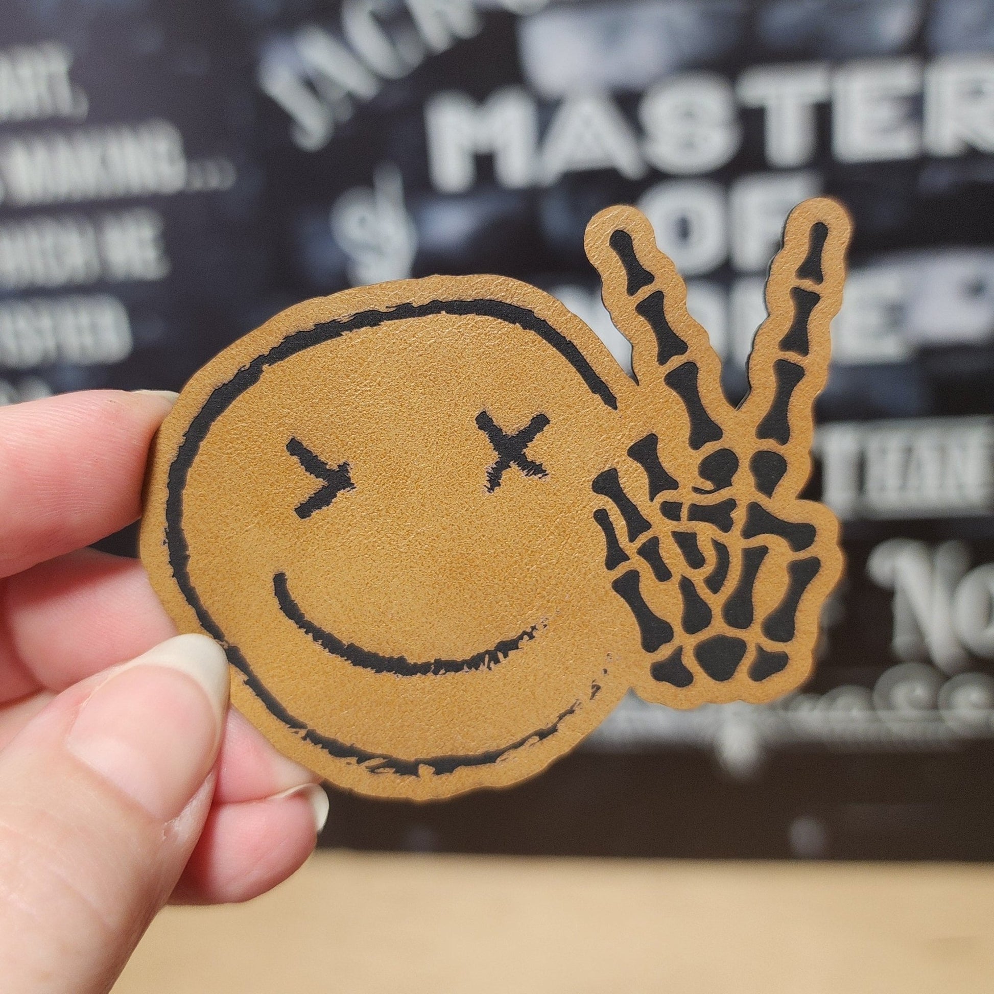 Peaceful Skull Smile (Saddle Tan) Engraved Leatherette Hat Patch - MR01 - LoneStar Adhesive