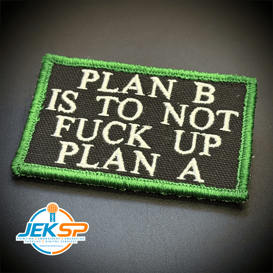 Front view of Plan B, Don't Fuck Up Plan A patch in black with white lettering and a green border