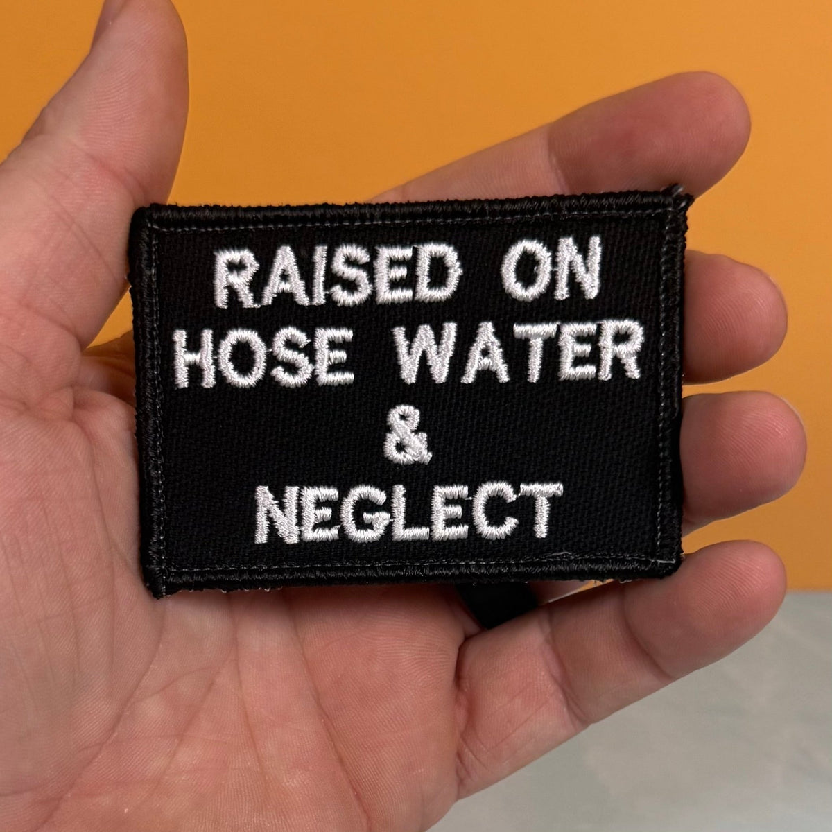 Raised on Hose Water & Neglect Funny Morale Patch, 2x3" | Made in USA | VELCRO® Brand Hook Backing - LoneStar Adhesive