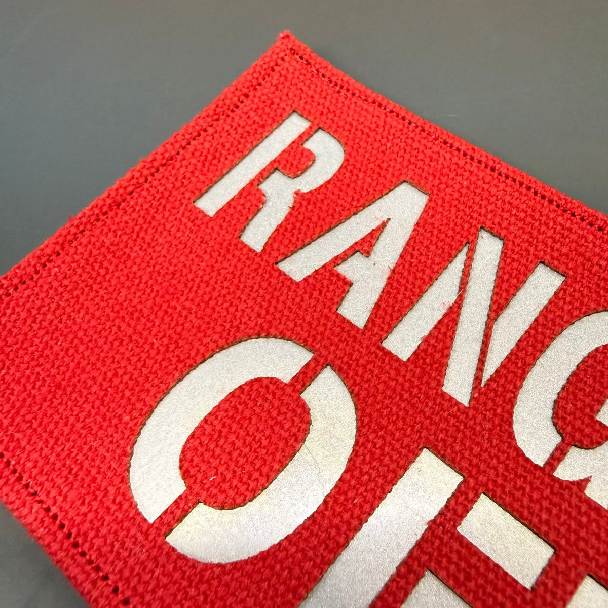 Range Safety Officer Patches & ID Panels patch in red with white Range Safety Officer lettering, close-up of cut lettering