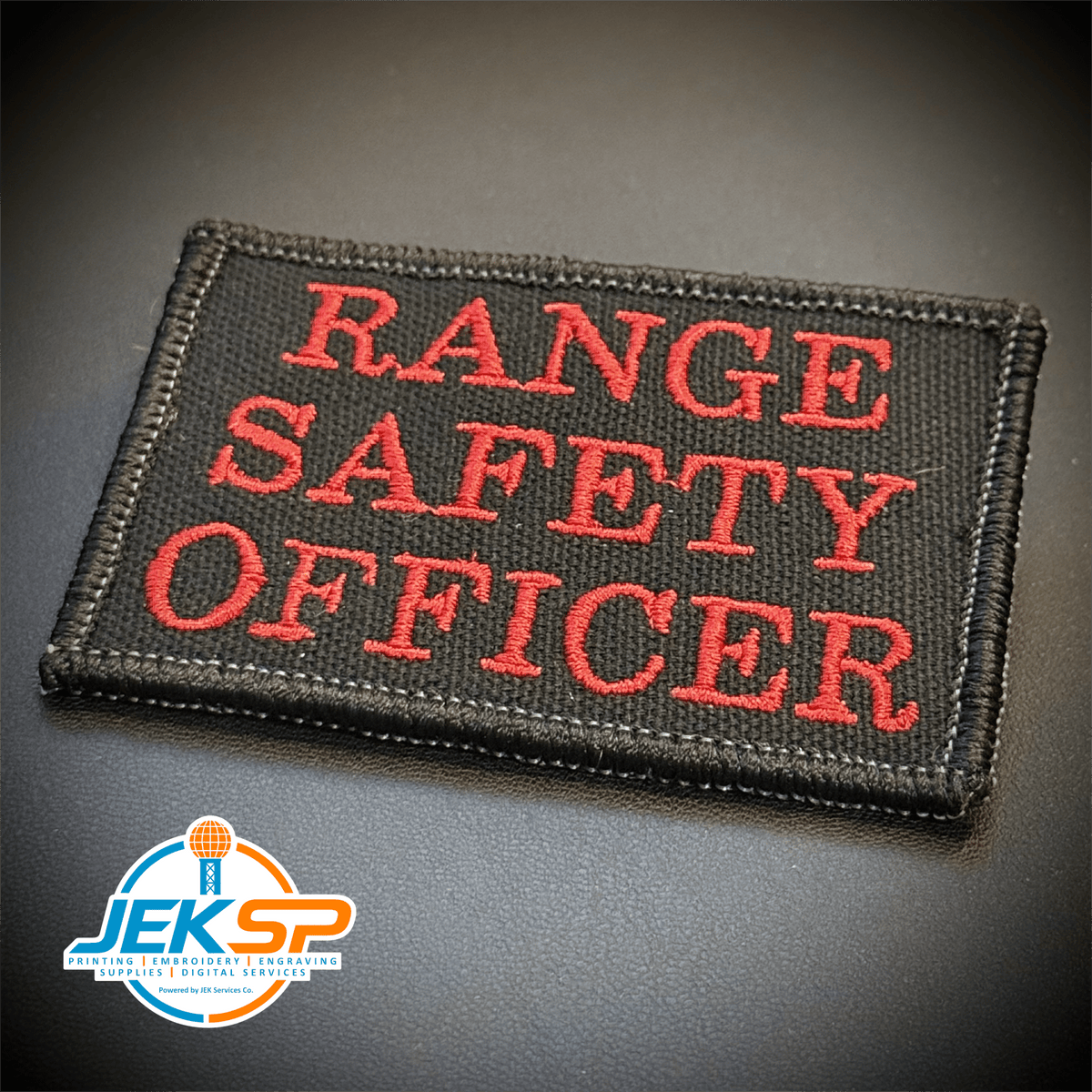 Front view of Range Safety Officer Patches & ID Panels patch in black with red Range Safety Officer lettering