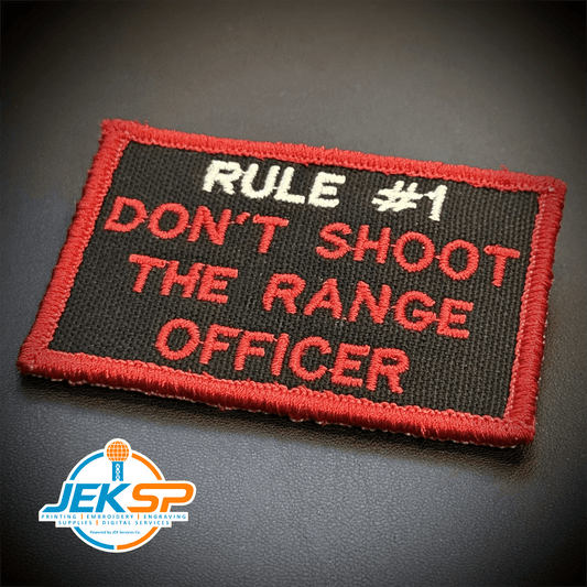 Front view of Rule #1 Don't Shoot The Range Officer patch in black with red lettering and border