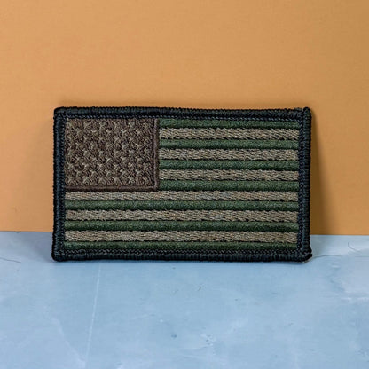 Front view of Subdued FDE Tactical American Flag patch in subdued tan and green American flag