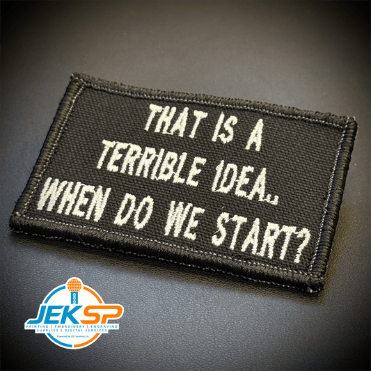 Front view of That's A Terrible Idea. When Do We Start? patch in black with white lettering