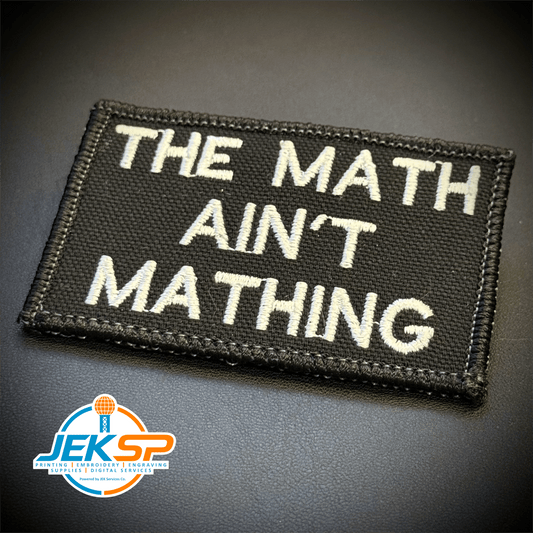 Front view of The Math Ain't Mathing patch in black with white lettering