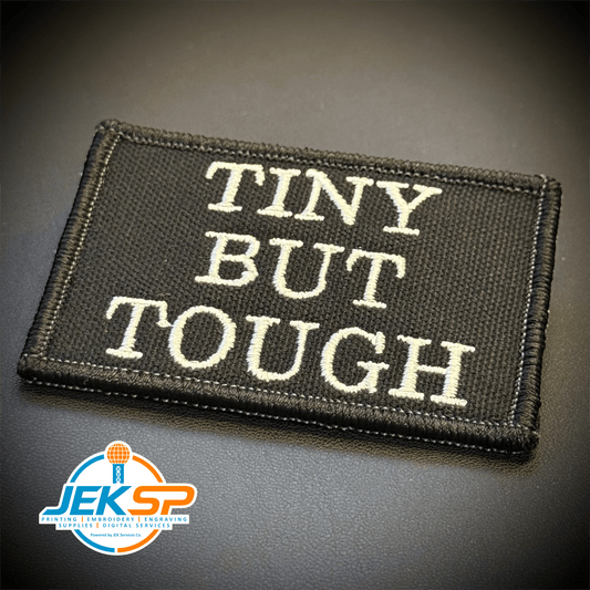 Front view of Tiny But Tough patch in black with white lettering