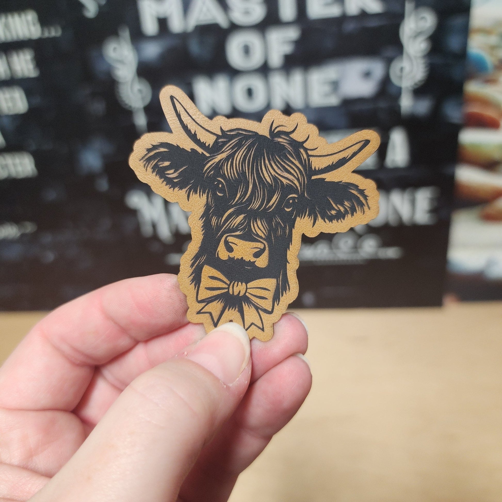 Whimsical Cow with Bowtie (Saddle Tan) Engraved Leatherette Hat Patch - MR01 - LoneStar Adhesive