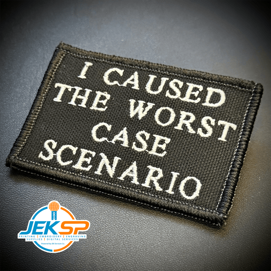 Front view of Worst Case Scenario patch in black with white lettering